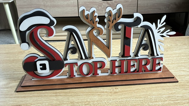 Laser cut layered painted signs on stand - Image 2