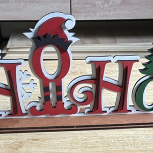 Laser cut layered painted signs on stand