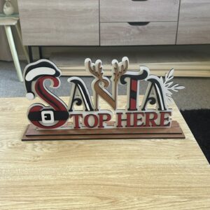 Laser cut layered painted signs on stand