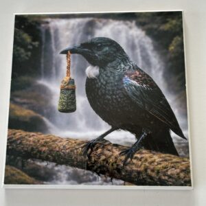 Tui Holding Māori Green Stone Carving On Tile